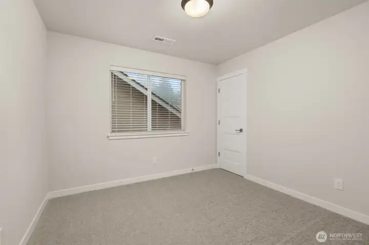 Second bedroom on upper floor.