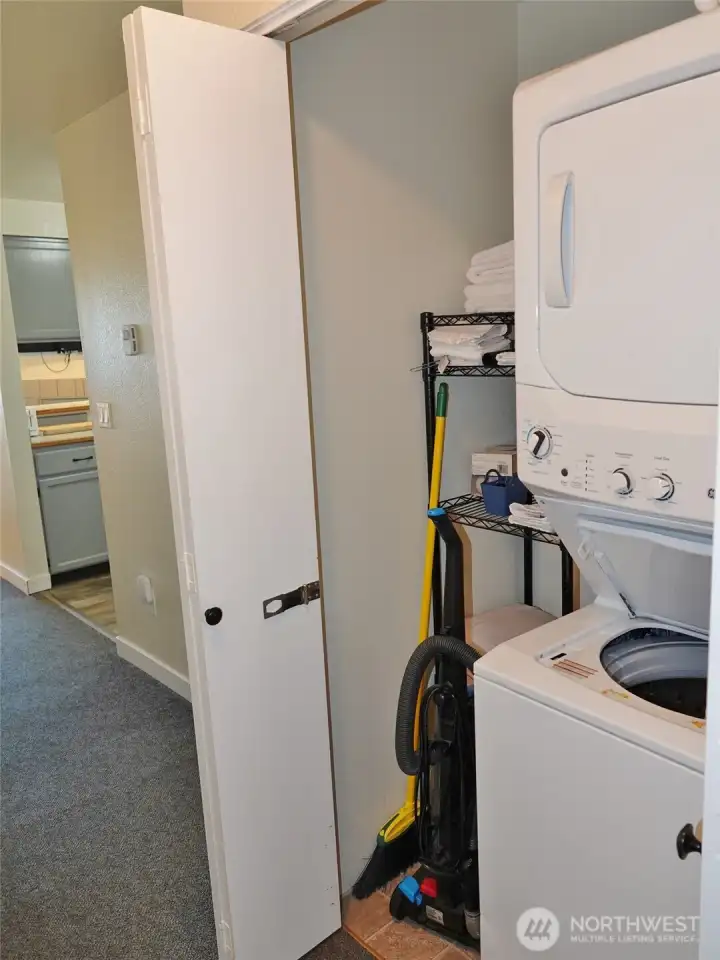 Stackable washer/dryer in closet.