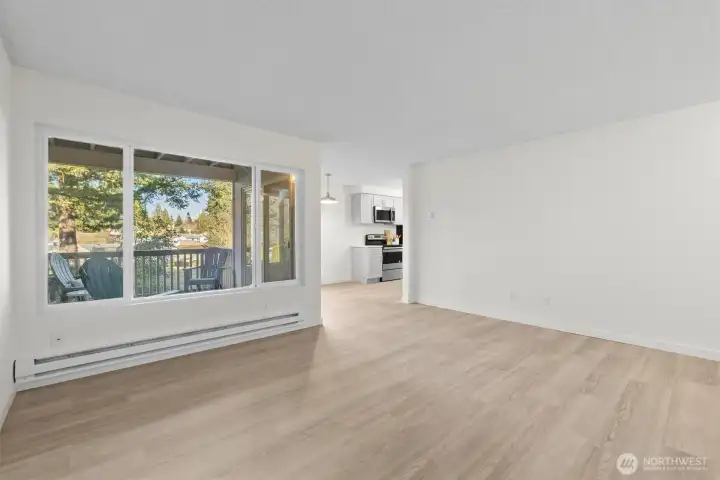 Huge window in the living room allows natural light to shine in.