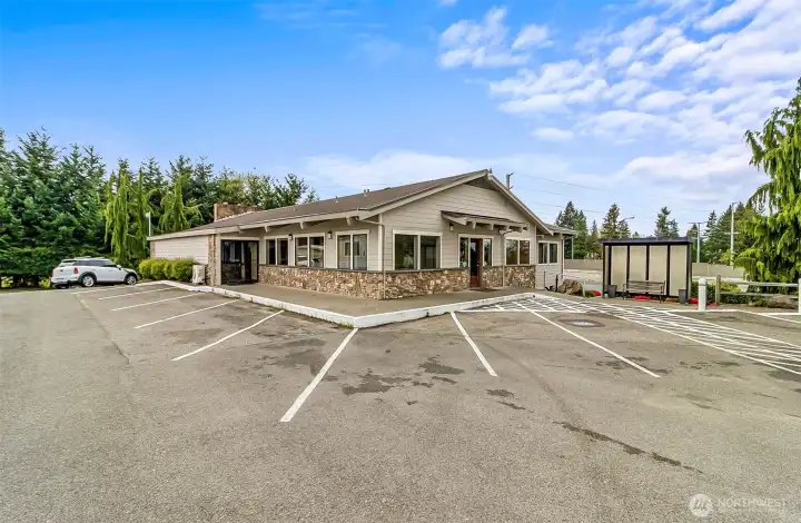 Club house with a ton of amenities. Kitchen with eating area, work out gym, laundry facility and outdoor pool.