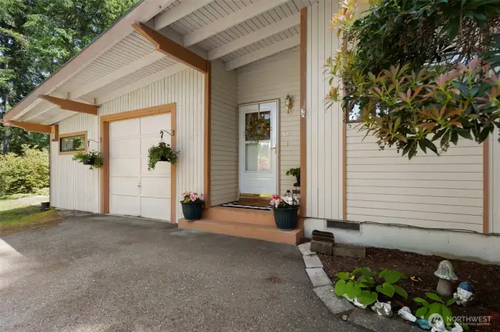 Lovely front porch and golf-cart garage