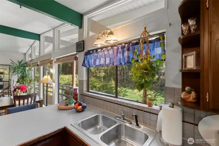 Watch the golfers as you prepare your meals!