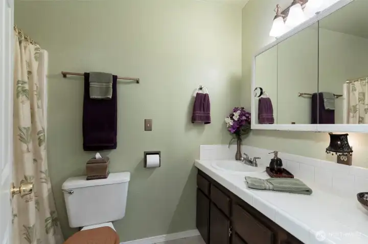 Convenient 2nd bathroom across the hall from the laundry cove