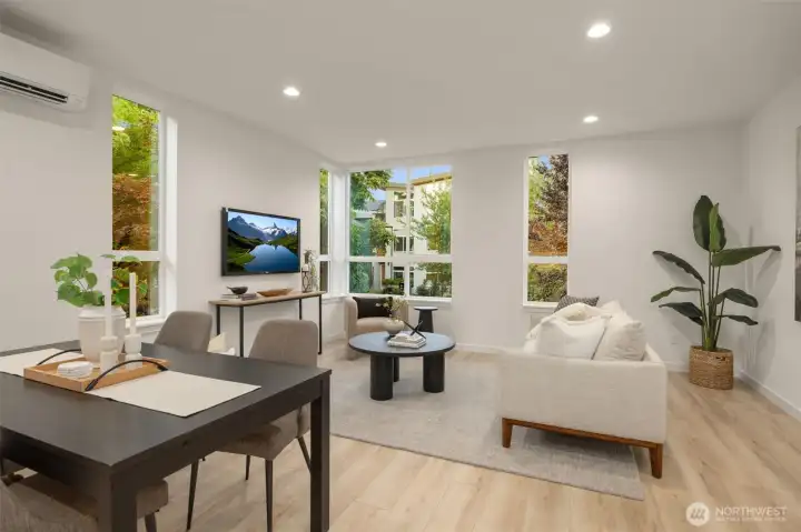 Sun-drenched main living area perfect for entertaining, complete with large windows and custom built-ins. (photos are of model home, similar finishes & quality)