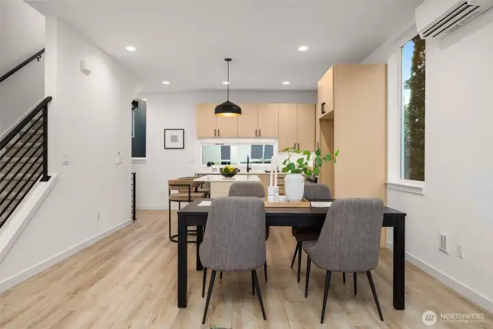 Transition landing featuring an additional dining or flexible seating area next to the stairwell. (photos are of model home, similar finishes & quality)