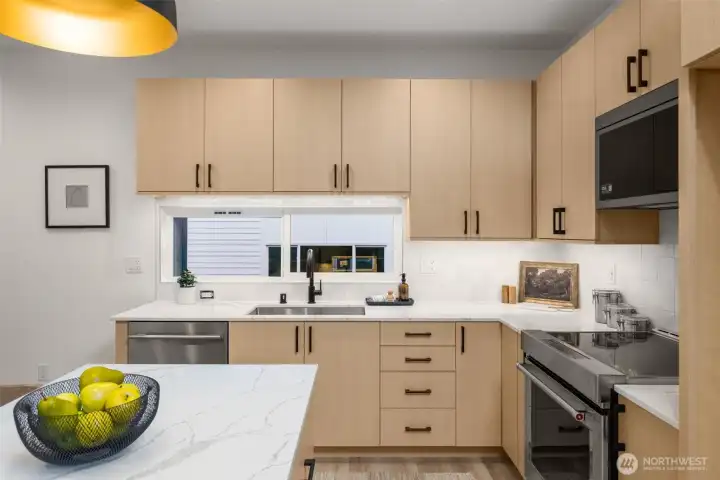 Convenient upper-level kitchenette/wet bar area, perfect for morning coffee or entertaining guests. (photos are of model home, similar finishes & quality)