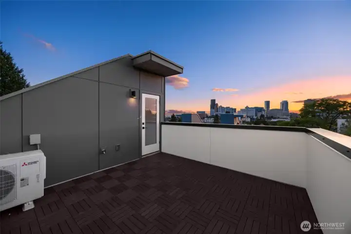 Step out onto the expansive rooftop deck, an incredible private oasis for outdoor dining and lounging. (photos are of model home, similar finishes & quality)