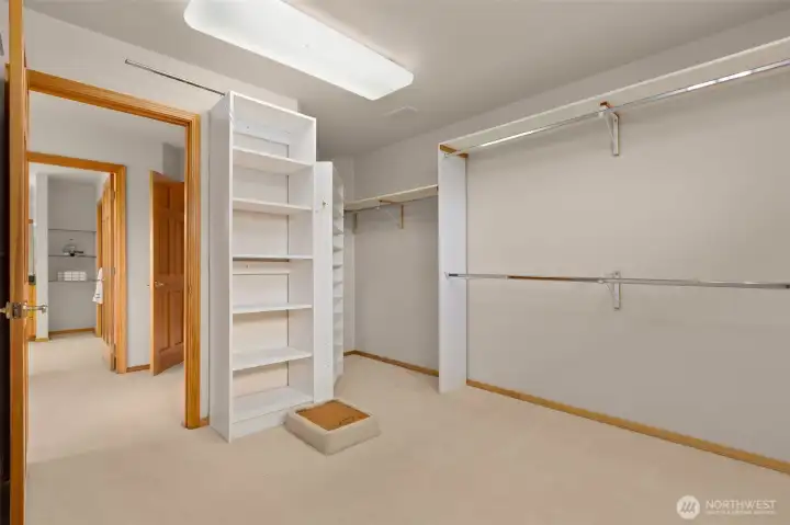 Walk-in closet in the primary. with a laundry chute!