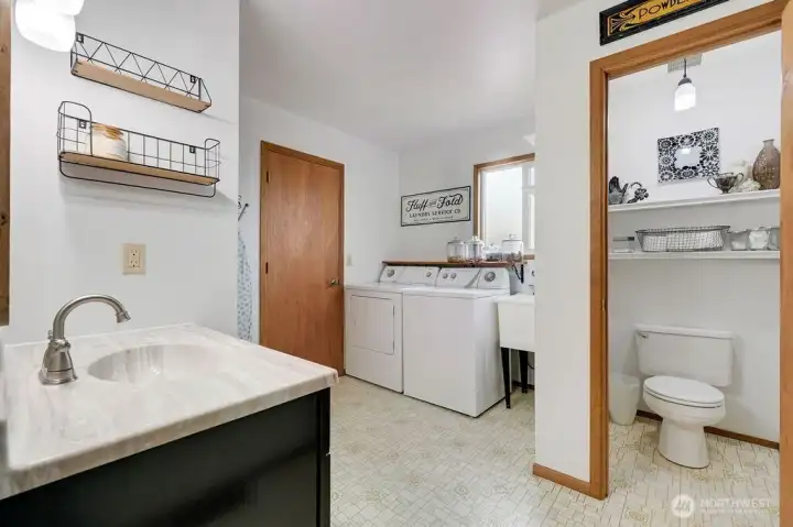 Spacious mudroom with bathroom.