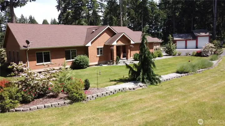 Experience ultimate privacy and luxury in this impressive single-story brick home, offering 2,696 sqft, 4 beds, 2.5 baths, with soaring cathedral ceilings and pristine hardwood floors. 2012 quality construction by one of the areas premier stone masons with no OSB. Entire home boasts high-end finishes throughout. Highlights include 9 foot ceilings, solid wood trim and doors, granite countertops, soft close cabinets, beautiful stone hearth, hardwoods through main living, wood burning stove, and spa-like stone and granite two-headed shower in primary suite. Climate-controlled comfort provided by a high-efficiency heat pump/AC. Entertain year-round with a flowing great room concept that spills through French doors onto the large enclosed, tongue & groove sunroom/patio. Fully fenced and gated backyard area. Experience ultimate privacy and luxury in this impressive single-story brick home, offering 2,696 sqft, 4 beds, 2.5 baths, with soaring cathedral ceilings and pristine hardwood floors. 2012 quality construction by one of the areas premier stone masons with no OSB. Entire home boasts high-end finishes throughout. Highlights include 9 foot ceilings, solid wood trim and doors, granite countertops, soft close cabinets, beautiful stone hearth, hardwoods through main living, wood burning stove, and spa-like stone and granite two-headed shower in primary suite. Climate-controlled comfort provided by a high-efficiency heat pump/AC. Entertain year-round with a flowing great room concept that spills through French doors onto the large enclosed, tongue & groove sunroom/patio. Fully fenced and gated backyard area.