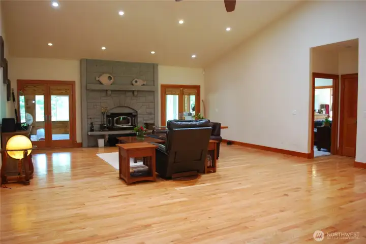 Soaring cathedral ceiling in great room, kitchen, and dinning area. Nine foot ceilings throughout the rest of home. Beautiful hardwood floors in main areas. French doors lead to large, tongue and groove, enclosed patio/sunroom. Primary bedroom suite off the great room. Soaring cathedral ceiling in great room, kitchen, and dinning area. Nine foot ceilings throughout the rest of home. Beautiful hardwood floors in main areas. French doors lead to large, tongue and groove, enclosed patio/sunroom. Primary bedroom suite off the great room.