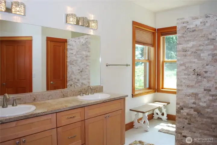 Large Primary suite with ceiling fan and generous sized bath. Two sinks with granite counter tops, separate toilet closet, big walk in closet, and a spa like granite and stone double headed shower. Large Primary suite with ceiling fan and generous sized bath. Two sinks with granite counter tops, separate toilet closet, big walk in closet, and a spa like granite and stone double headed shower.