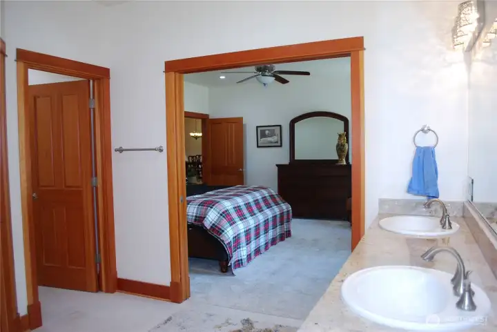 Large Primary suite with ceiling fan and generous sized bath. Two sinks with granite counter tops, separate toilet closet, big walk in closet, and a spa like granite and stone double headed shower. Large Primary suite with ceiling fan and generous sized bath. Two sinks with granite counter tops, separate toilet closet, big walk in closet, and a spa like granite and stone double headed shower.