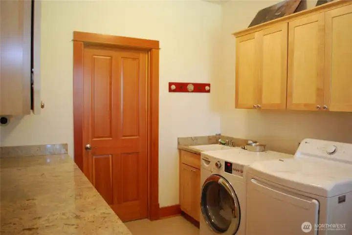 Granite counter tops with plenty of lower and upper cabinets, utility sink, and an adjoining utility / canning storage room Granite counter tops with plenty of lower and upper cabinets, utility sink, and an adjoining utility / canning storage room