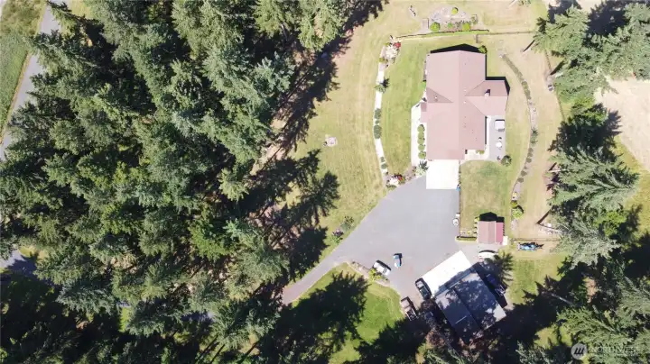 Other property perks include a hot tub, covered RV parking, separate well house, and a massive 3-bay, high-clearance shop featuring an EV charging plug and a built-in auto lift for the heavy-duty hobbyist. Country setting with no HOA on 4.29 wooded acres close-in to the city of Yelm. With access to shopping, restaurants, JBLM, I-5, Olympia, and Tacoma this home will not disappoint. 2026 Tax Assessed Value, $1,146,400. Other property perks include a hot tub, covered RV parking, separate well house, and a massive 3-bay, high-clearance shop featuring an EV charging plug and a built-in auto lift for the heavy-duty hobbyist. Country setting with no HOA on 4.29 wooded acres close-in to the city of Yelm. With access to shopping, restaurants, JBLM, I-5, Olympia, and Tacoma this home will not disappoint. 2026 Tax Assessed Value, $1,146,400.