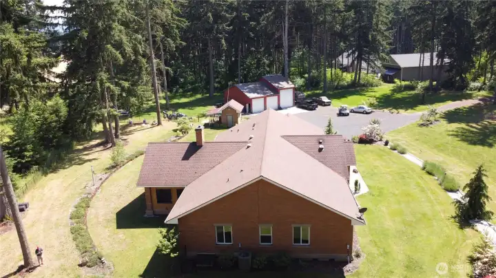Other property perks include a hot tub, covered RV parking, separate well house, and a massive 3-bay, high-clearance shop featuring an EV charging plug and a built-in auto lift for the heavy-duty hobbyist. Country setting with no HOA on 4.29 wooded acres close-in to the city of Yelm. With access to shopping, restaurants, JBLM, I-5, Olympia, and Tacoma this home will not disappoint. 2026 Tax Assessed Value, $1,146,400. Other property perks include a hot tub, covered RV parking, separate well house, and a massive 3-bay, high-clearance shop featuring an EV charging plug and a built-in auto lift for the heavy-duty hobbyist. Country setting with no HOA on 4.29 wooded acres close-in to the city of Yelm. With access to shopping, restaurants, JBLM, I-5, Olympia, and Tacoma this home will not disappoint. 2026 Tax Assessed Value, $1,146,400.