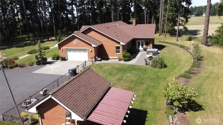 Other property perks include a hot tub, covered RV parking, separate well house, and a massive 3-bay, high-clearance shop featuring an EV charging plug and a built-in auto lift for the heavy-duty hobbyist. Country setting with no HOA on 4.29 wooded acres close-in to the city of Yelm. With access to shopping, restaurants, JBLM, I-5, Olympia, and Tacoma this home will not disappoint. 2026 Tax Assessed Value, $1,146,400. Other property perks include a hot tub, covered RV parking, separate well house, and a massive 3-bay, high-clearance shop featuring an EV charging plug and a built-in auto lift for the heavy-duty hobbyist. Country setting with no HOA on 4.29 wooded acres close-in to the city of Yelm. With access to shopping, restaurants, JBLM, I-5, Olympia, and Tacoma this home will not disappoint. 2026 Tax Assessed Value, $1,146,400.