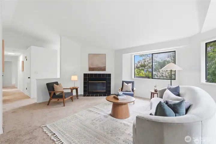 Spacious living room with vaulted ceilings. Laundry hook ups available in the hallway closet.