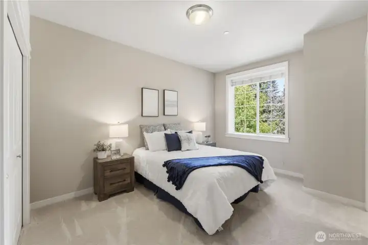 The second ensuite upstairs offers a bright, welcoming feel. The bathroom is just to the right (not shown), and both rooms are filled with gentle morning light