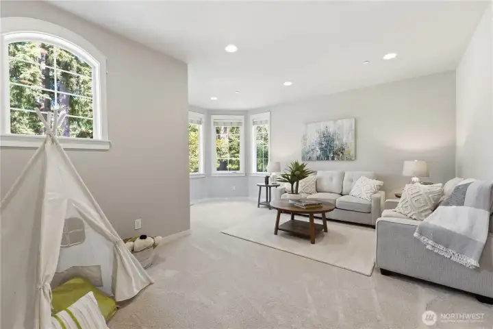 Upstairs bonus room that works beautifully as a TV room, rec room, large office, or anything you imagine