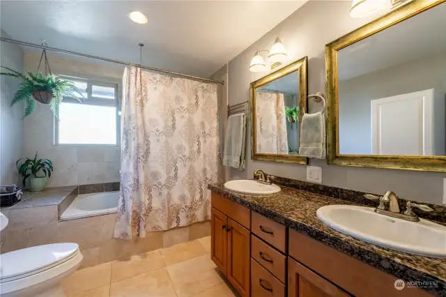 Updated Primary bathroom with double sinks, soaking tub and shower.