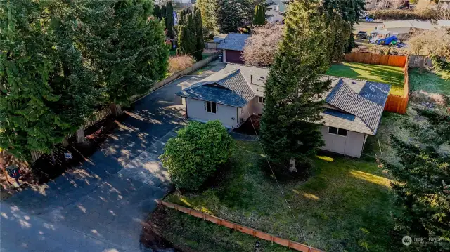 Look at all this space. Large, fenced back yard and direct access to-car shop.