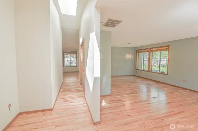 Front Entry into Family room and Dining room, Hallway Closet, and Primary Bedroom access