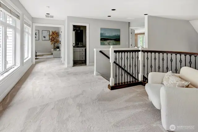 Large landing area at the top of the beautiful stair case.