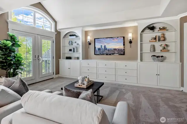 Custom built-ins provide lots of storage in drawers, cupboards and shelving.  The center is a perfect space for your TV.