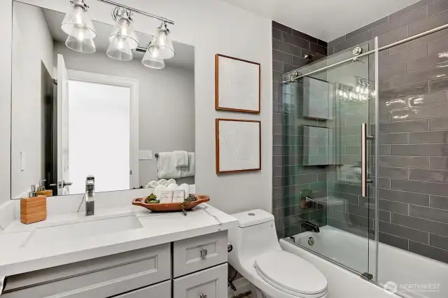 Guest bathroom on the upper floor has been tastefully updated.