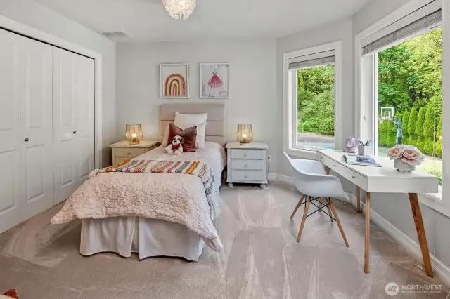 Bedroom #3 provides a beautiful view of the backyard and green space.