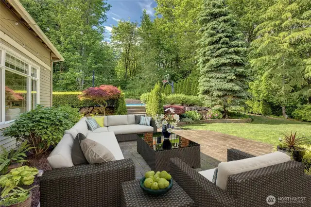 Digitally staged furnishings provide outdoor seating to enjoy the privacy of your backyard oasis.