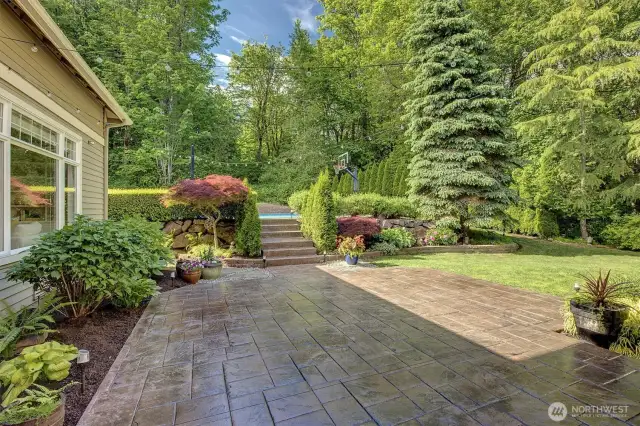 Large stamped concrete area provides ample space for outdoor dining and lounge seating.