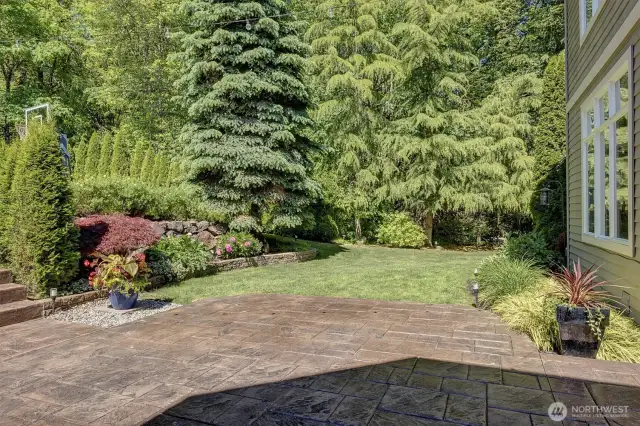 Imagine having this private view of the lush landscaping while you are lounging or dining outside on your stamped concrete patio.