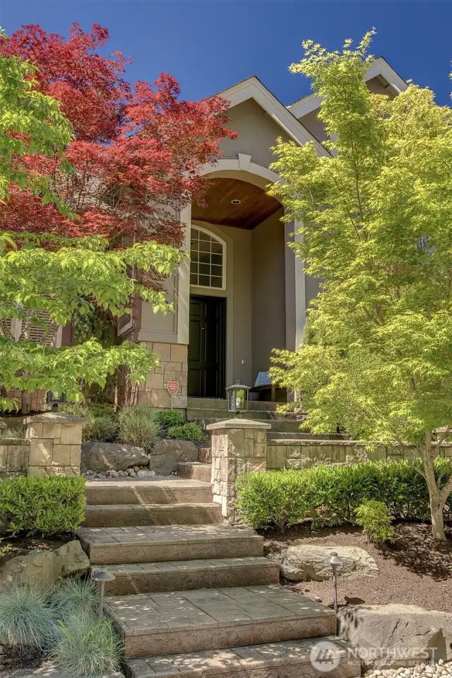 Custom stamped concrete entryway add a level of sophistication.