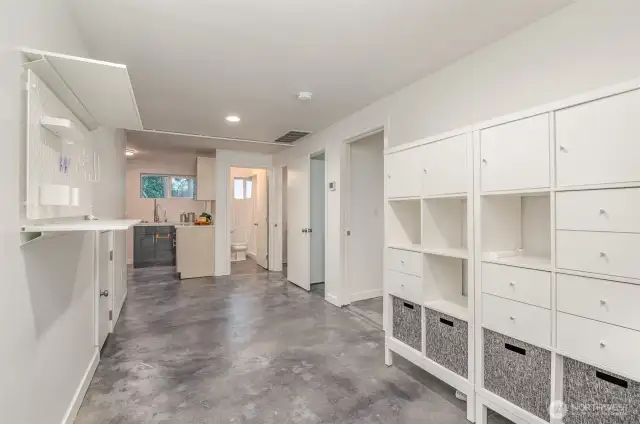 Sweeping lower level with kitchen, bathroom bedroom spaces