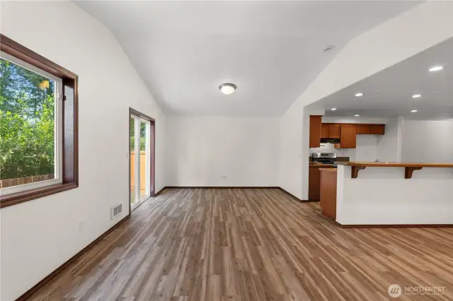 Stunning vaulted ceilings and large window flood the space with abundant natural light.