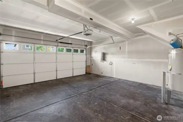 Spacious garage with new garage door & smart garage door opener.