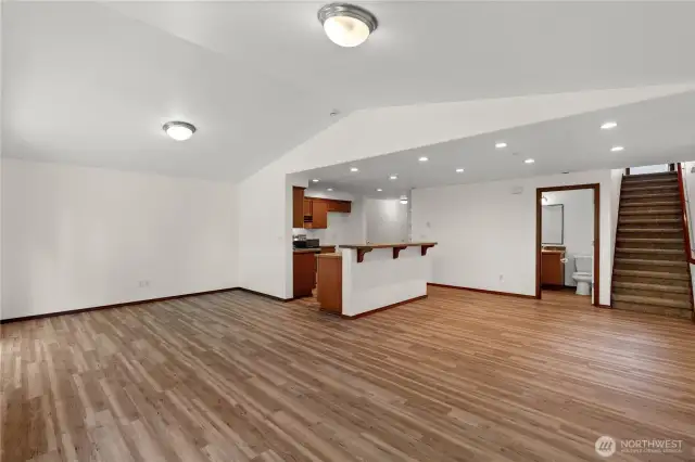 The spacious open floor plan effortlessly combines the living, dining, and kitchen areas—perfect for entertaining and everyday living.