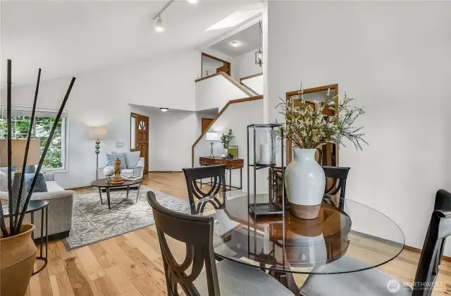 Stairs to the 2nd floor near the entry - efficient layout!  Garage door is there as well as laundry and half bath past the door to the garage.