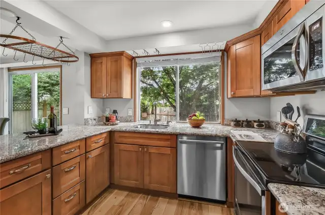 The kitchen looks out into the back yard.