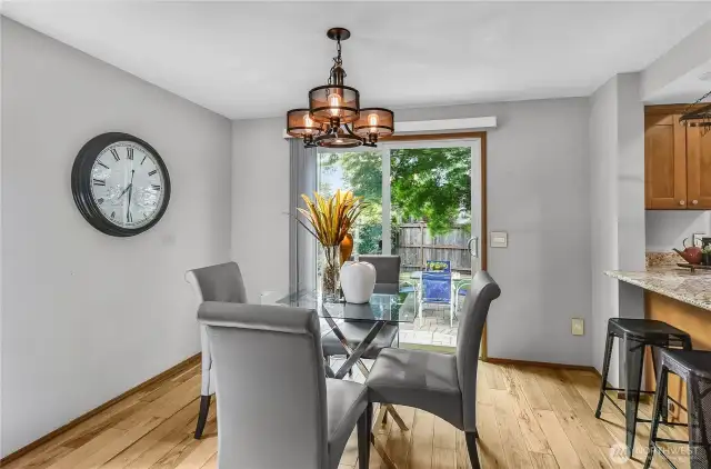 On the other side of the kitchen bar seating area is another eating area adjacent to the back patio.  Lots of seating space for eating and chatting!