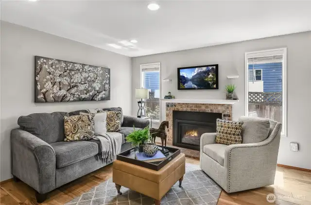 Here's the family room with gas fireplace and the same beautiful wood floors.