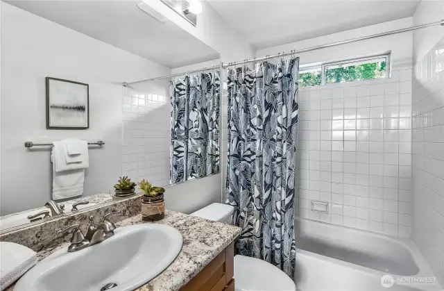 Hallway bathroom has a tub/shower for those of you who like to take baths.