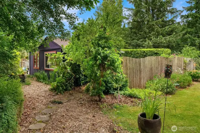 This property has been designed and cultivated to feel so much larger than 1/3 acre; lots of separate, private, secret gardens!