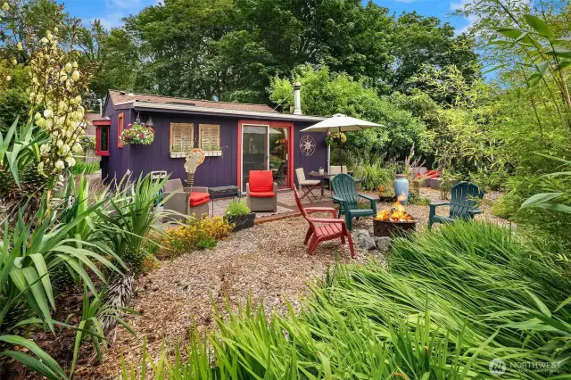 Secret back garden & deck of DADU. Can you believe how much this property offers?
