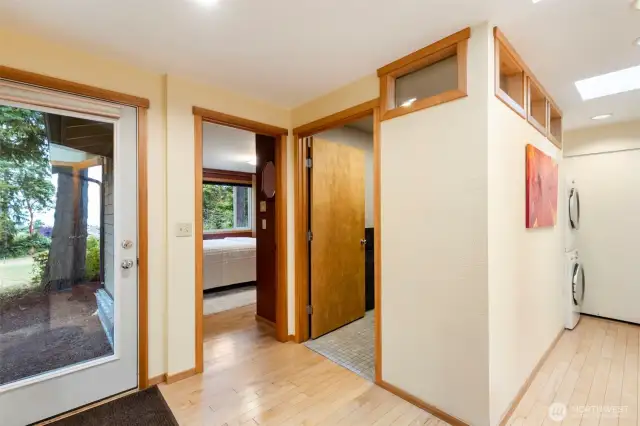 Backdoor, and view to the primary bedroom. The bathroom here isn't an ensuite, but this bedroom has close access.