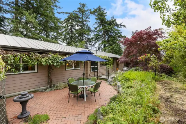 Backyard patio oasis. Veggie/Garden beds can be added to the right in the upper terraced yard.