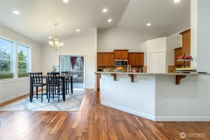 Large kitchen with SS appliances and granite countertops.