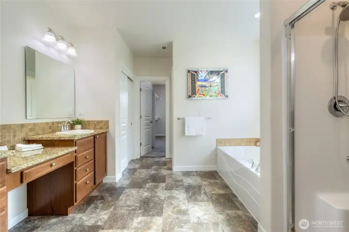 Primary bath with dual sinks, soaker tub plus shower.